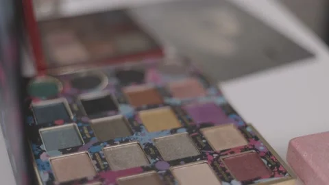 Make up brush and colourful pallet of powder with mirror in lid Stock Footage 188762925