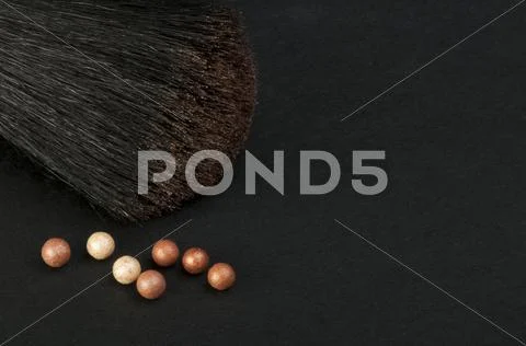 Make up brush and pearls Stock Photos