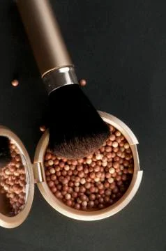 Make up brush and pearls Stock Photos