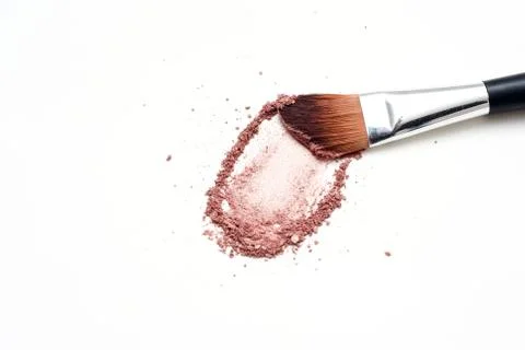 Make up brush with brush stroke of colored make up powder Stock Photos