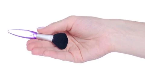 Make up brush in hand Stock Photos