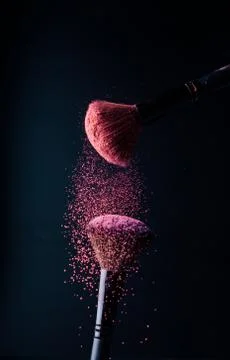 Make-up brush with p powder explosion Stock Photos