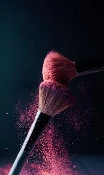 Make-up brush with p powder explosion Stock Photos