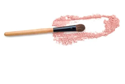 Make-up brush with three pink powder explosion Stock Photos