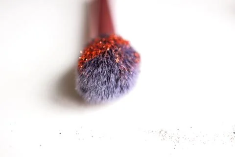 Make up brush on white background in glitter Stock Photos