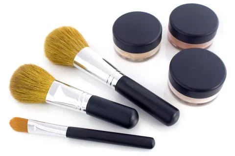 Make-up brushes and powder jars Stock Photos