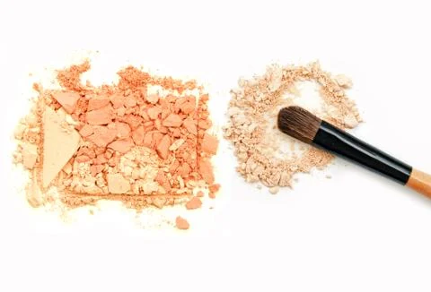 Make up brushes with brown and beige eye shadows on white background Stock-Fotos