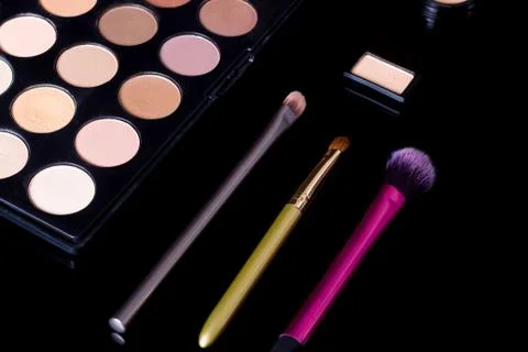 Make-up brushes. Eye shadow palette. Makeup kit. Cosmetic set. Beauty, fashio Stock Photos