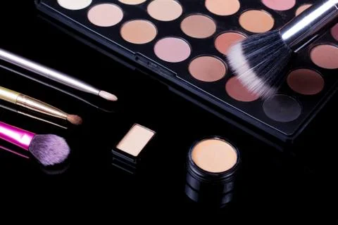 Make-up brushes. Eye shadow palette. Makeup kit. Cosmetic set. Beauty, fashio Photos