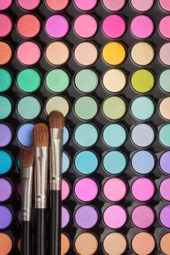 Make-up brushes on eyeshadow make-up palette with copyspace Stock Photos