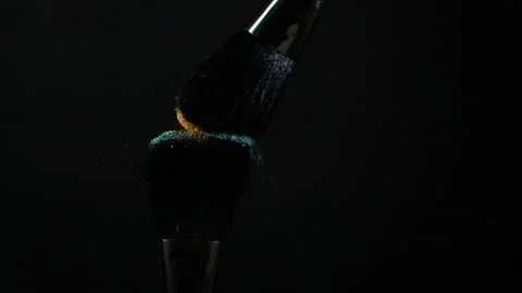 Make-up brushes with glitter golden and green color eye shadow powder Stock Footage 171309254