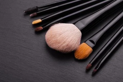 Make-up brushes on grey background Stock Photos