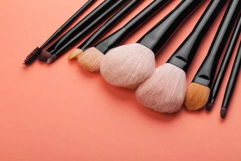Make-up brushes on pink background Stock-Fotos