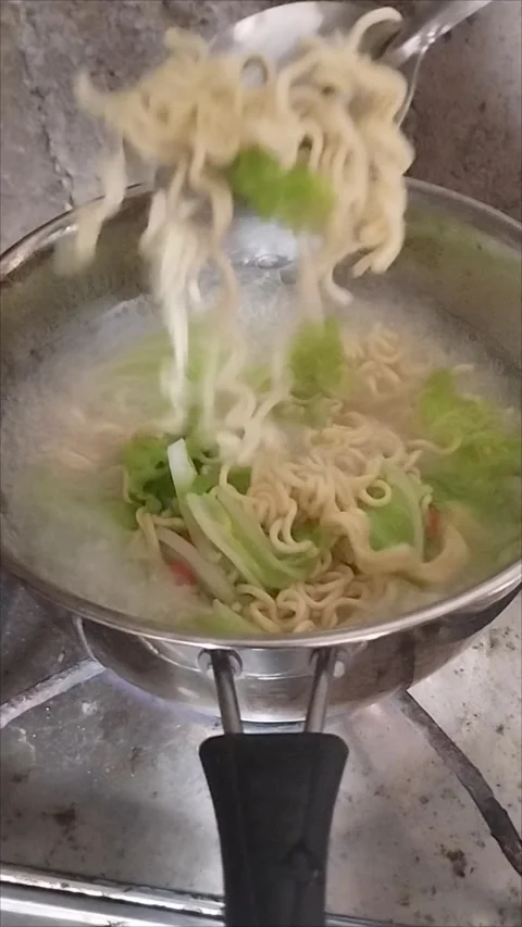 Make cabbage vegetable noodle soup Stock Footage 293115711