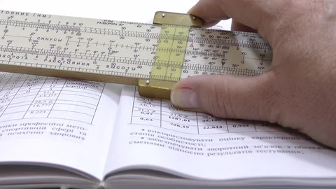 Make calculations on a logarithmic ruler. Stock Footage 108633071