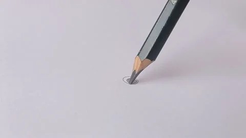 Make a circle with a pencil on the blank paper Stock Footage 150666320