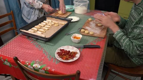 Make cookies from dough and place on a baking sheet. Cook at home. Baked goods Stock Footage 311127370