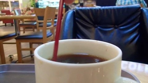 Make a cup of hot coffee with stick In coffee shop. Stock Footage 89719355