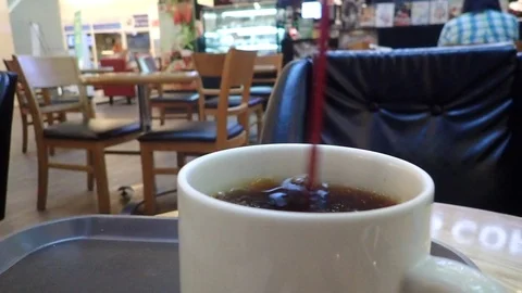 Make a cup of hot coffee with stick In coffee shop. Stock Footage 89719675