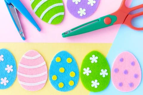 Make cute funny sweet Easter eggs from felt fabric Fotos de archivo