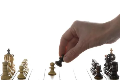 Make decisions and challenge. Chess player makes a move. Stock Photos