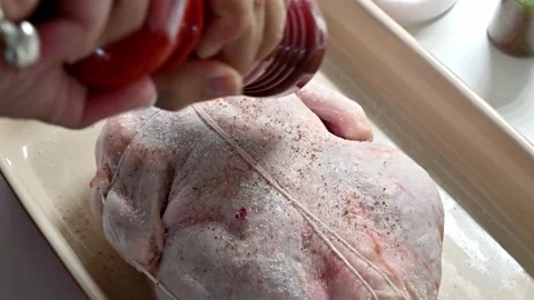 Make a delicious roast chicken in the oven. Adding spices Stock Footage 217972902