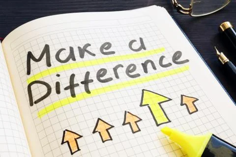 Make a difference handwritten in notepad. Foto stock
