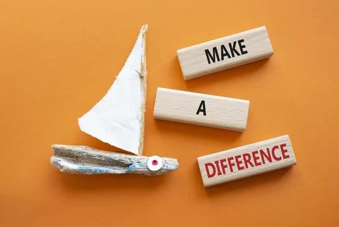 Make a difference symbol. Concept words Make a difference on wooden blocks... Stock Photos