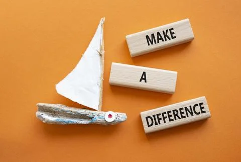 Make a difference symbol. Concept words Make a difference on wooden blocks... Stock Photos