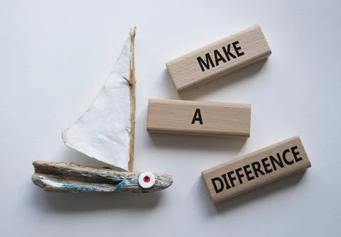 Make a difference symbol. Concept words Make a difference on wooden blocks... Stock Photos