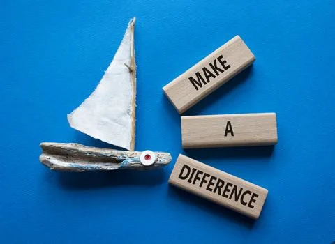 Make a difference symbol. Concept words Make a difference on wooden blocks... Stock Photos