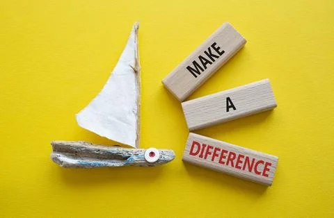 Make a difference symbol. Concept words Make a difference on wooden blocks... Stock Photos