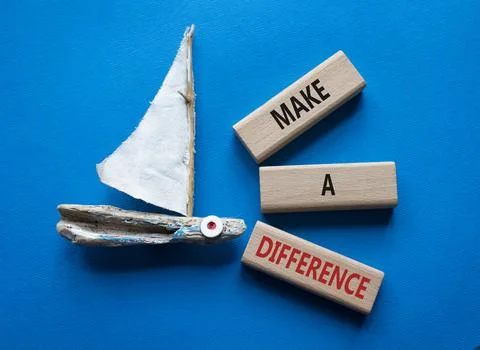 Make a difference symbol. Concept words Make a difference on wooden blocks. B Stock Photos