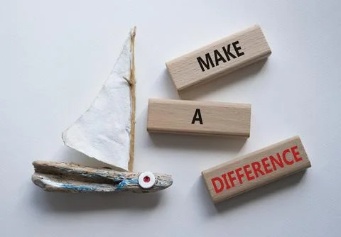 Make a difference symbol. Concept words Make a difference on wooden blocks... Stock Photos