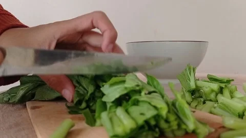 Make a dish with the green vegetable Stock Footage 149709257