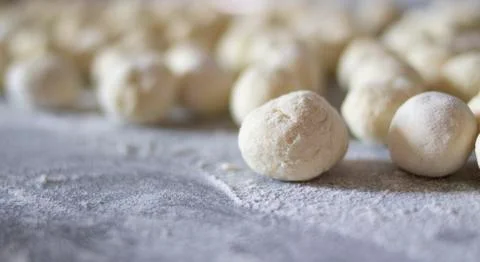 Make donuts on the table with flour Stock Photos