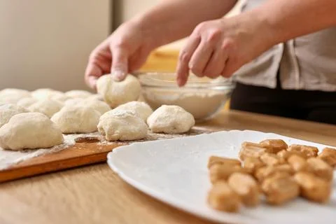To make donuts, toffee is added to the dough. The process of making donuts Stock Photos