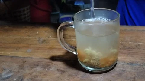 To make a drink which is often called Wedhang Jahe Stock Footage 236840098