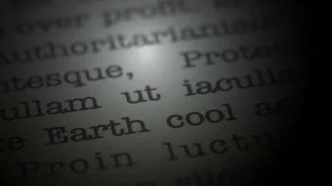 Make Earth cool again. Moving text printed on a page. Slow motion. Stock Footage 307286180