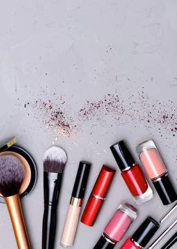Make up the essentials. A set of professional makeup brushes and cosmetics on Stock Photos