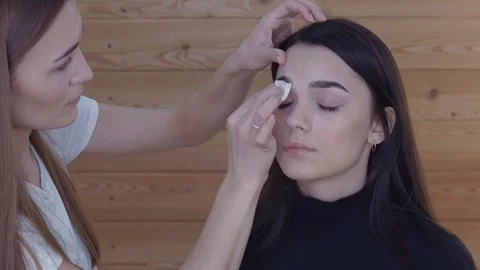 To Make Eyebrows. Master combs eyebrows model Stock Footage 102544137
