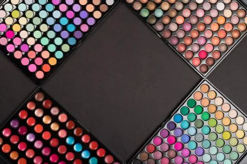 Make-up eyeshadow palettes on black background. Make-up template. Stock Photos