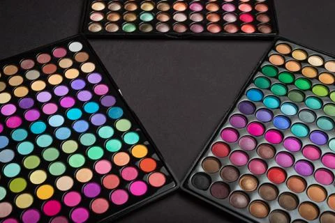 Make-up eyeshadow palettes as a make-up background Stock Photos