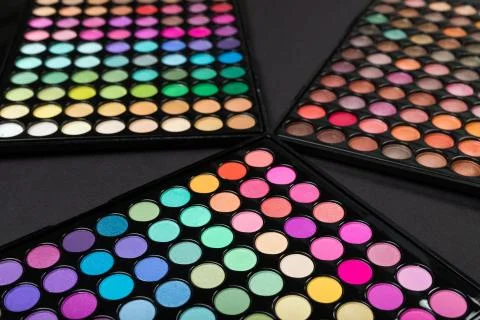 Make-up eyshadow palettes on a black background Stock Photos