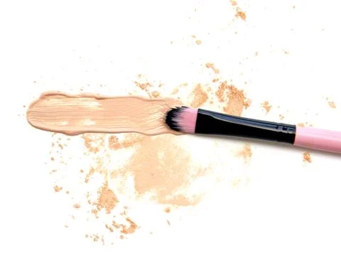 Make up foundation beige with crumbled powder make up on white background Stock-Fotos