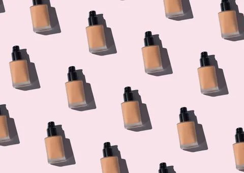 Make up foundation glass bottle pattern on pink Stock Photos