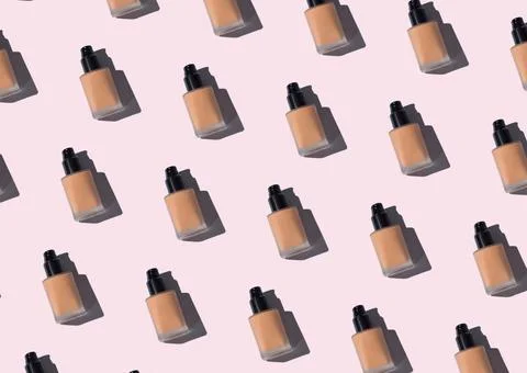 Make up foundation glass bottle pattern on pink Stock Photos