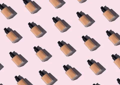 Make up foundation glass bottle pattern on pink Stock Photos