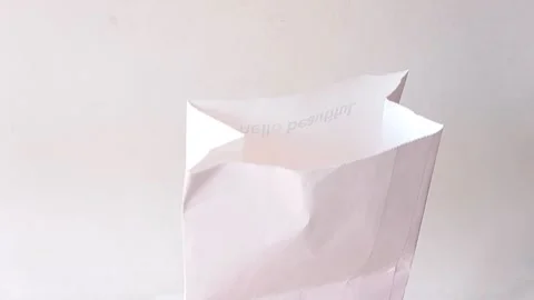 Make a gift for someone with a white wrapping paper Stock Footage 145562180