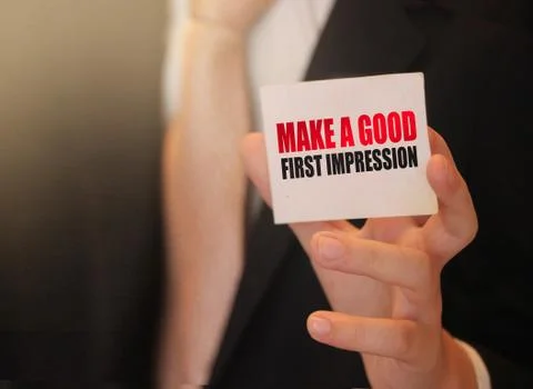 Make a good first impression on a card Businessman holding. Motivation and pe Stock Photos